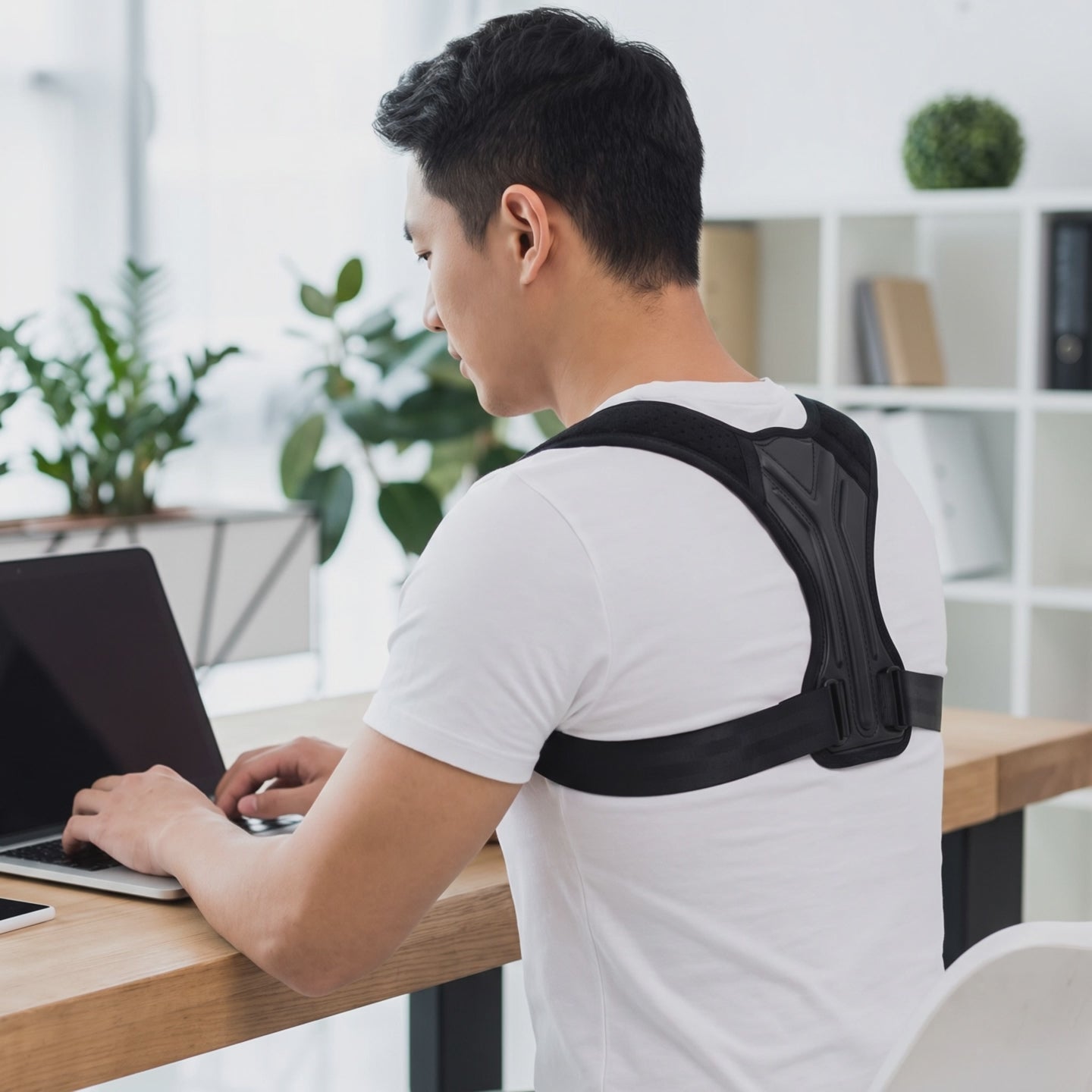 Posture corrector in use - office setting